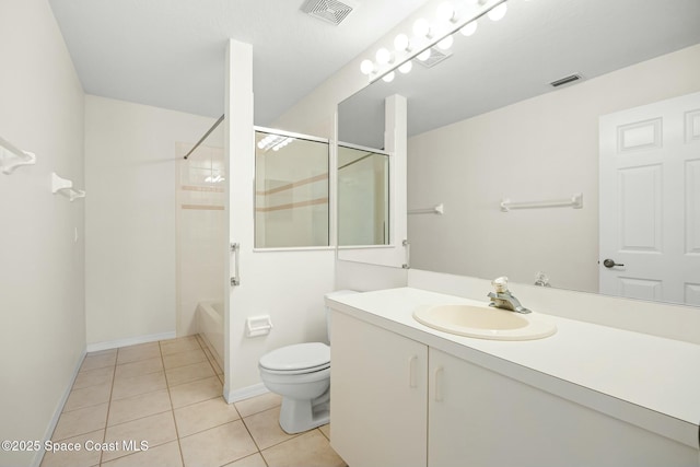 bathroom featuring visible vents, vanity, toilet, and tile patterned floors