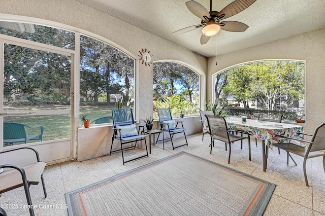 sunroom with a ceiling fan