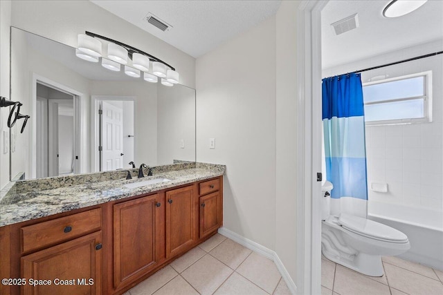 bathroom featuring toilet, visible vents, and tile patterned floors