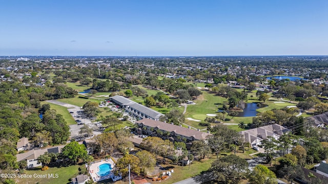 bird's eye view with view of golf course and a water view