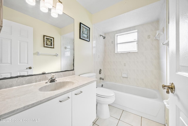 bathroom featuring  shower combination, vanity, tile patterned flooring, and toilet