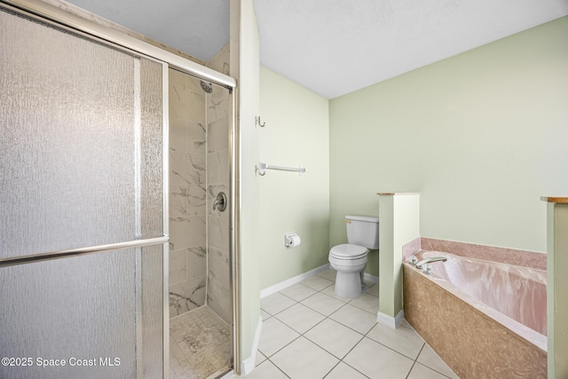 full bathroom featuring tile patterned flooring, a garden tub, toilet, baseboards, and a stall shower