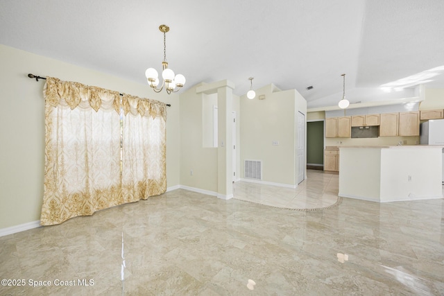 empty room with lofted ceiling, marble finish floor, visible vents, and baseboards