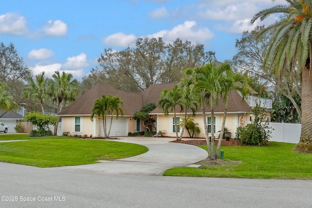 4813 Union Cypress Pl, Melbourne, FL 32904 - view of front of house with stucco siding, an attached garage, and driveway
