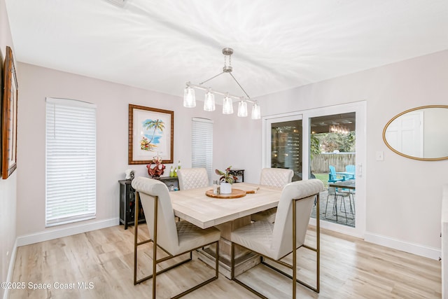 4813 Union Cypress Pl, Melbourne, FL 32904 - dining space featuring light wood-type flooring and baseboards