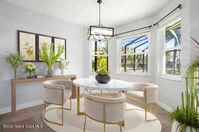 dining space featuring breakfast area and baseboards