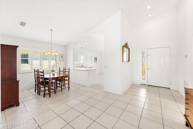 dining room with light tile patterned floors, visible vents, baseboards, an inviting chandelier, and recessed lighting