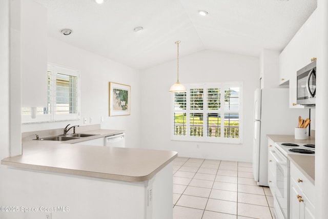 kitchen featuring white appliances, light tile patterned floors, lofted ceiling, light countertops, and a sink