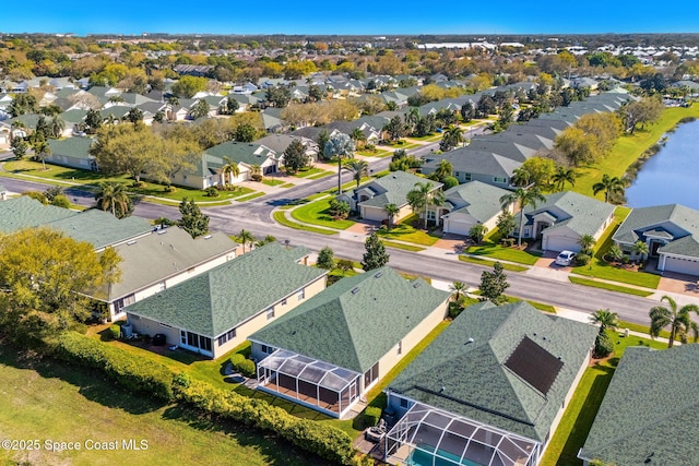 birds eye view of property featuring a residential view and a water view