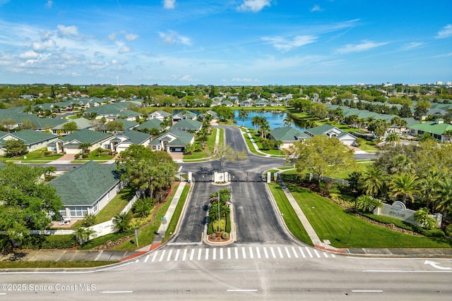 bird's eye view with a water view and a residential view