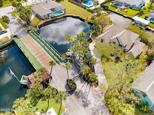 aerial view with a water view and a residential view