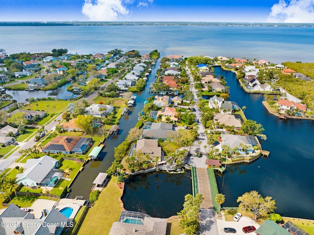 birds eye view of property with a residential view and a water view