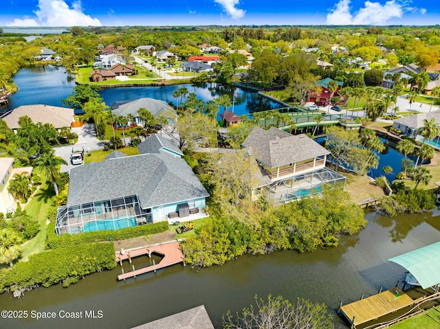 birds eye view of property with a residential view and a water view