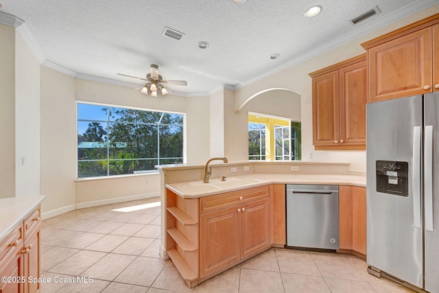 kitchen featuring a sink, visible vents, light countertops, appliances with stainless steel finishes, and open shelves