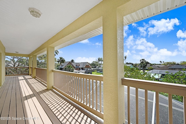 wooden deck with a residential view