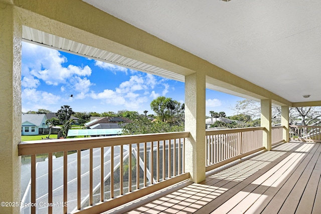 wooden terrace with a residential view