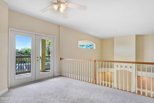 carpeted spare room with french doors