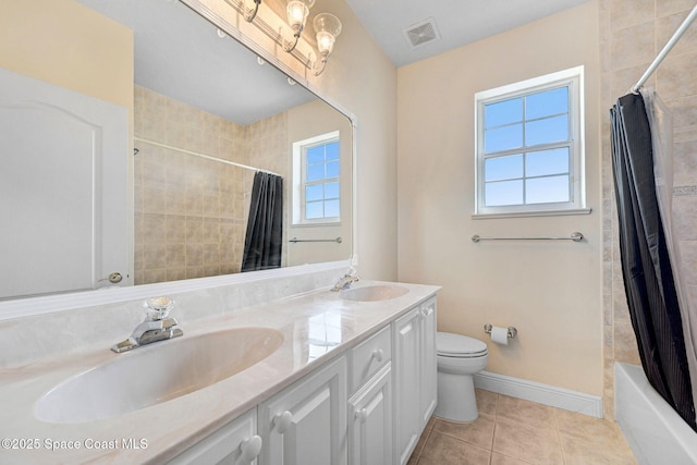 full bathroom featuring toilet, tile patterned flooring, visible vents, and a sink