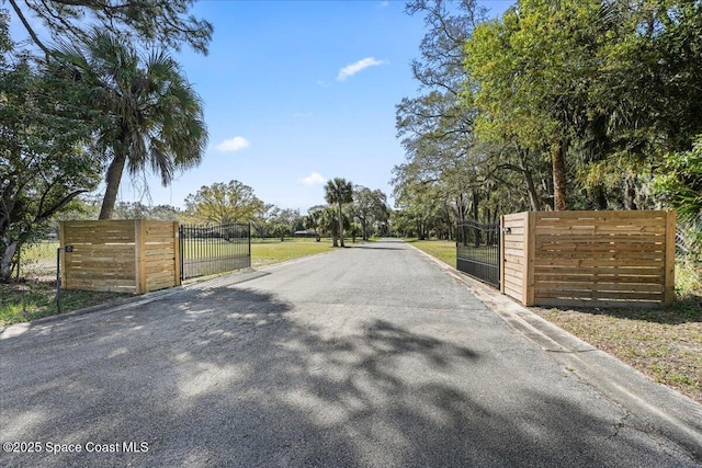 view of road featuring a gate