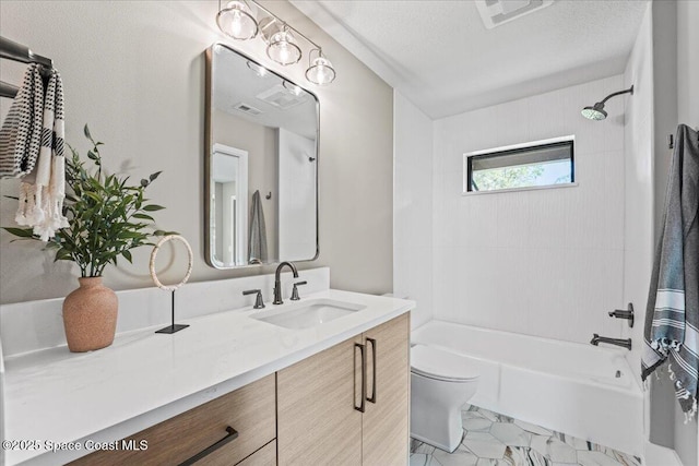 bathroom with visible vents, toilet, a textured ceiling, vanity, and shower / bathing tub combination