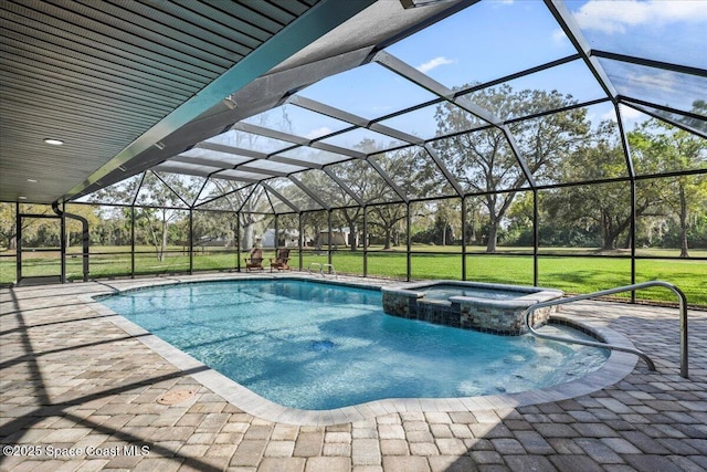 view of pool with a pool with connected hot tub, a patio area, a yard, and a lanai