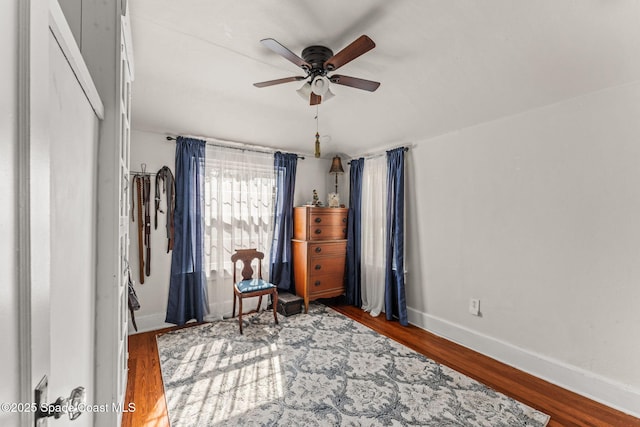 2109 Indian River Dr, Cocoa, FL 32922 - sitting room featuring ceiling fan, wood finished floors, and baseboards