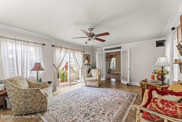 2109 Indian River Dr, Cocoa, FL 32922 - living area featuring ornamental molding, a ceiling fan, baseboards, and a textured ceiling
