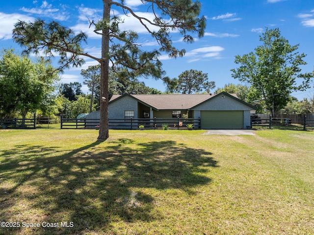 view of front of home with a garage, driveway, a front lawn, and fence