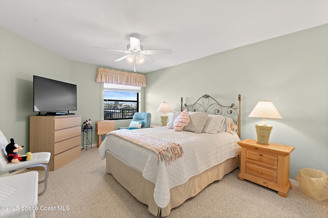 bedroom featuring light carpet and ceiling fan