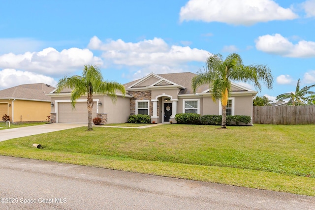 single story home with concrete driveway, stone siding, an attached garage, fence, and a front yard