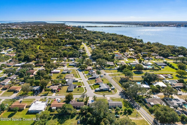 birds eye view of property featuring a residential view and a water view