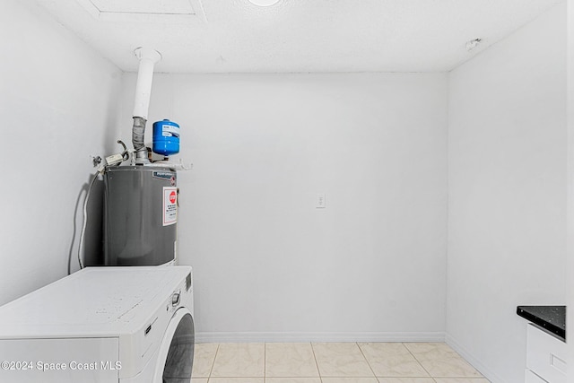 laundry room featuring water heater, laundry area, washer / clothes dryer, and baseboards