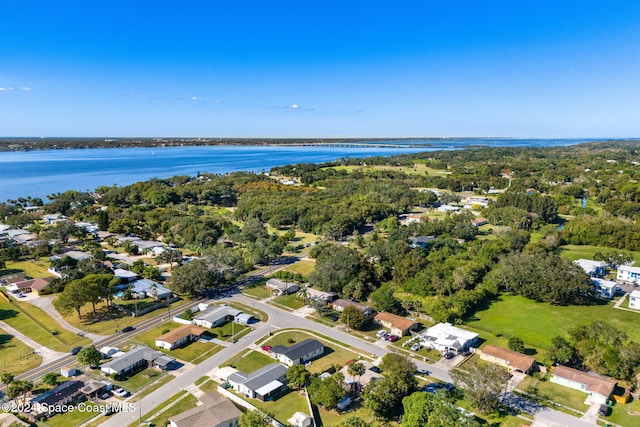 drone / aerial view with a residential view and a water view