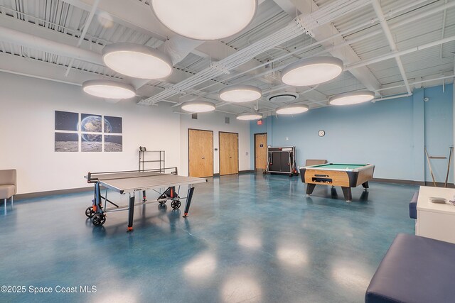 rec room featuring concrete flooring, pool table, and baseboards