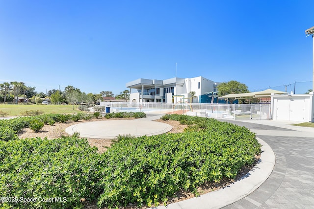 surrounding community with a gate and fence