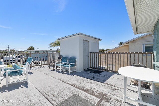 view of patio featuring a balcony