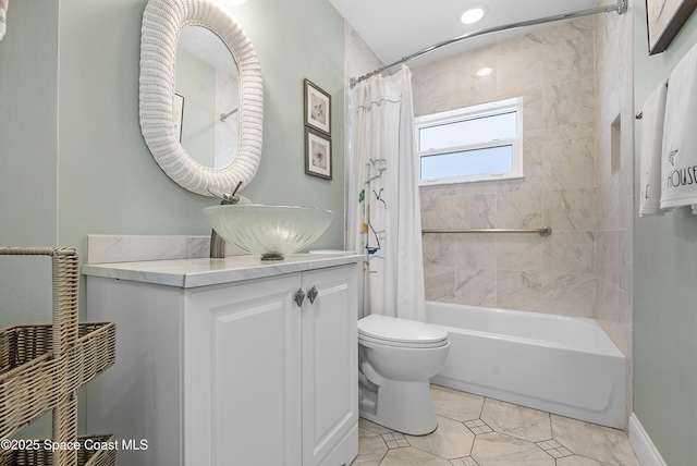 bathroom with vanity, toilet, and shower / tub combo with curtain