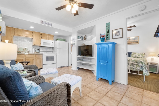 living room featuring a ceiling fan, recessed lighting, and light tile patterned floors