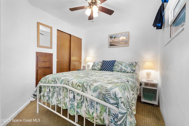 bedroom featuring a closet, ceiling fan, and baseboards