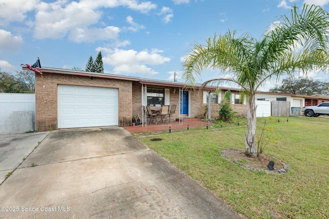 ranch-style house with a garage, concrete driveway, a front lawn, and fence