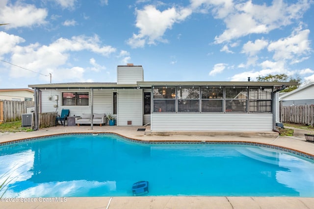 view of swimming pool featuring fence, a fenced in pool, and a patio