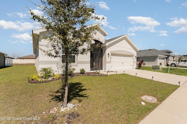 view of front of property with a garage, driveway, a front yard, and stucco siding