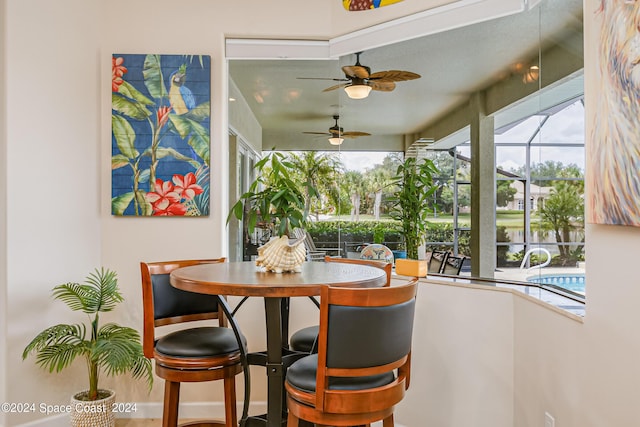 dining space featuring a sunroom