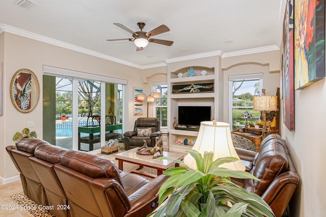 living room with ceiling fan, visible vents, and ornamental molding