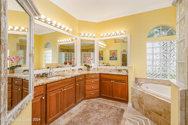 full bathroom with double vanity, a garden tub, crown molding, and a sink