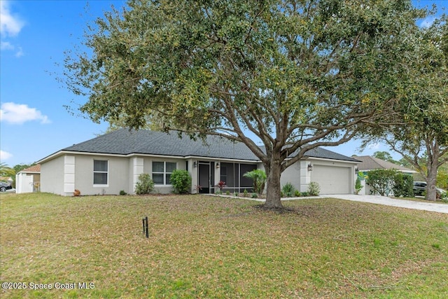 single story home featuring a garage, concrete driveway, a front yard, and stucco siding