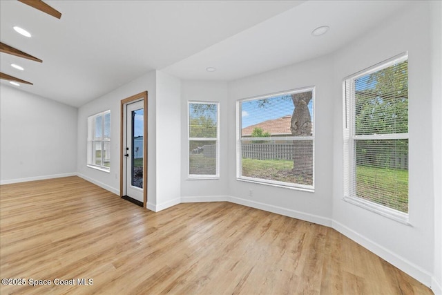 unfurnished room featuring light wood-type flooring, baseboards, and recessed lighting