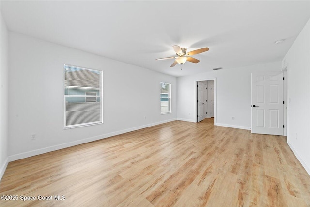 unfurnished bedroom with light wood-style floors, visible vents, baseboards, and a ceiling fan