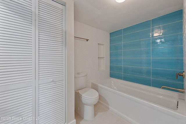 full bathroom featuring toilet, shower / bathtub combination, a closet, and tile patterned floors