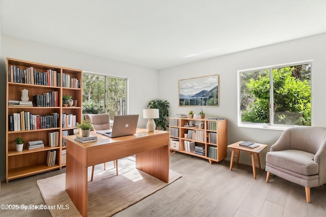 office area with light wood-style flooring